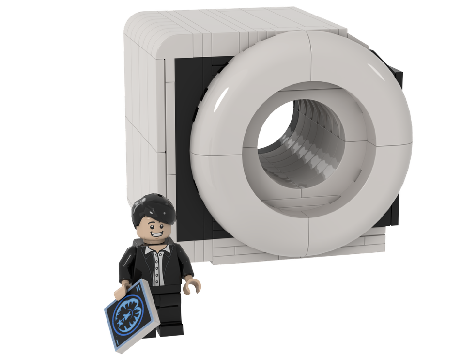 A LEGO figure of June Kang beside a model MRI scanner